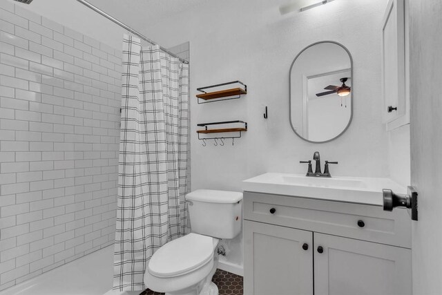 4406 Dove Springs Dr, Austin, TX 78744 - full bathroom with toilet, vanity, a ceiling fan, and a shower with shower curtain