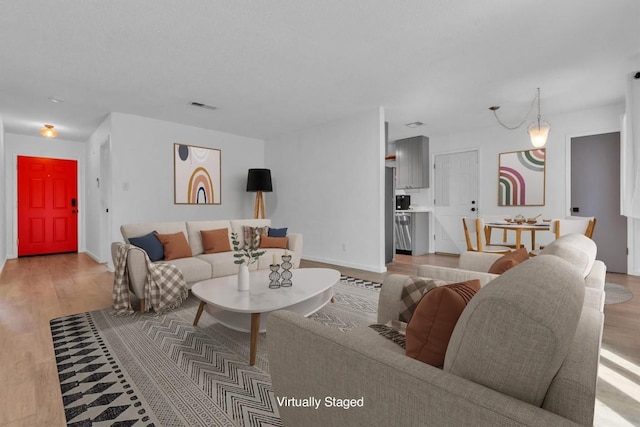 4406 Dove Springs Dr, Austin, TX 78744 - living room featuring light wood finished floors and baseboards