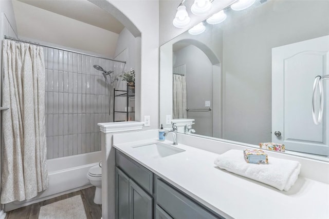 302 Emory Fields Dr, Hutto, TX 78634 - full bath featuring toilet, vanity, wood finished floors, and shower / tub combo
