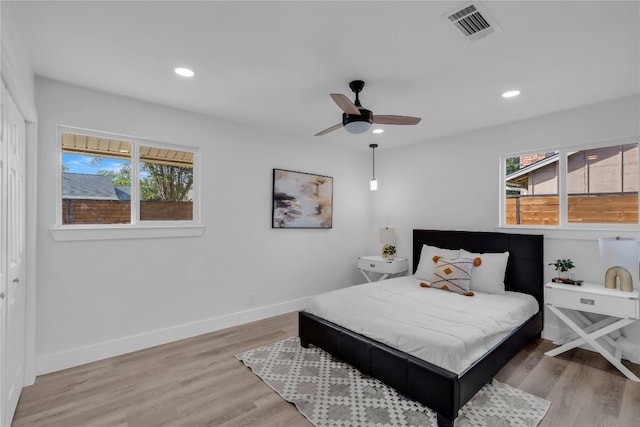 11602 Big Trl, Austin, TX 78759 - bedroom with wood finished floors, baseboards, recessed lighting, and a ceiling fan