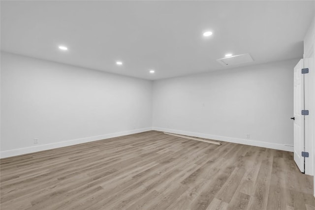 11602 Big Trl, Austin, TX 78759 - spare room with attic access, baseboards, light wood-style flooring, and recessed lighting
