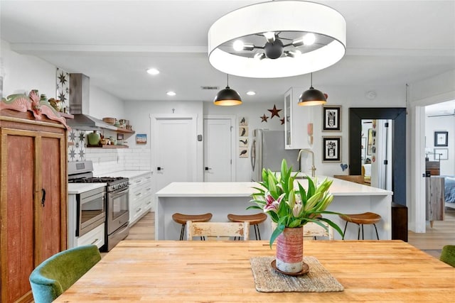 2406 Shiloh Dr, Austin, TX 78745 - dining space featuring light wood finished floors and recessed lighting