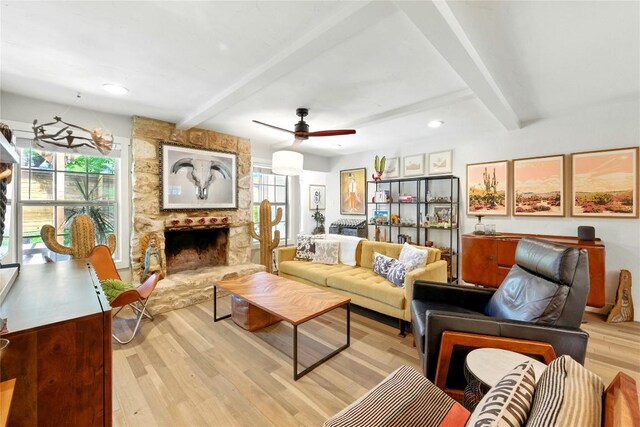 2406 Shiloh Dr, Austin, TX 78745 - living room with beam ceiling, plenty of natural light, light wood-type flooring, a stone fireplace, and recessed lighting
