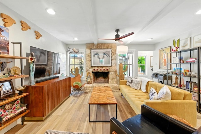 2406 Shiloh Dr, Austin, TX 78745 - living room with beam ceiling, ceiling fan, light wood-type flooring, a fireplace, and healthy amount of natural light