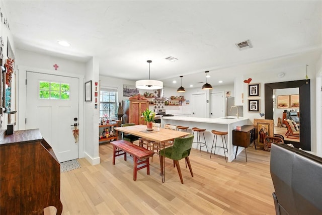 2406 Shiloh Dr, Austin, TX 78745 - dining room with light wood-style flooring and recessed lighting