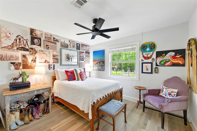 2406 Shiloh Dr, Austin, TX 78745 - bedroom with wood finished floors, baseboards, and ceiling fan