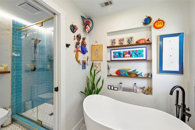 2406 Shiloh Dr, Austin, TX 78745 - full bath featuring a soaking tub, a stall shower, toilet, and tile patterned floors