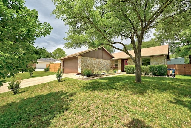 2406 Shiloh Dr, Austin, TX 78745 - view of front of house with stone siding, concrete driveway, and a garage