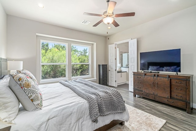 1280 Lucca Dr, Dripping Springs, TX 78620 - bedroom with wood finished floors, recessed lighting, a ceiling fan, connected bathroom, and baseboards