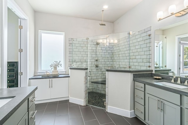 1280 Lucca Dr, Dripping Springs, TX 78620 - full bathroom featuring a stall shower, two vanities, tile patterned floors, and a chandelier