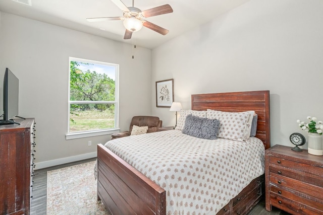 1280 Lucca Dr, Dripping Springs, TX 78620 - bedroom with wood finished floors, baseboards, and ceiling fan