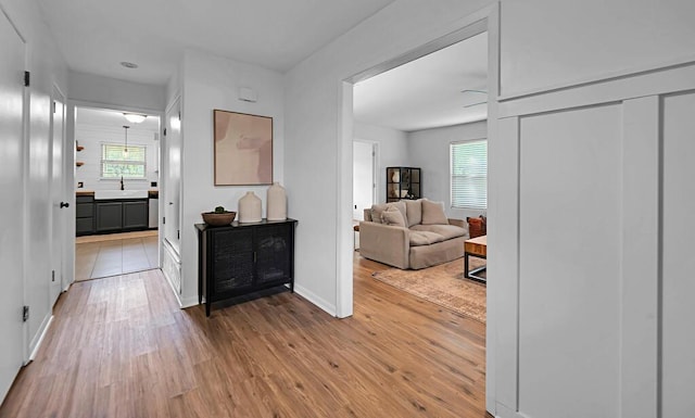 3506 Oakridge Blvd, Harker Heights, TX 76548 - hallway featuring light wood finished floors and a sink