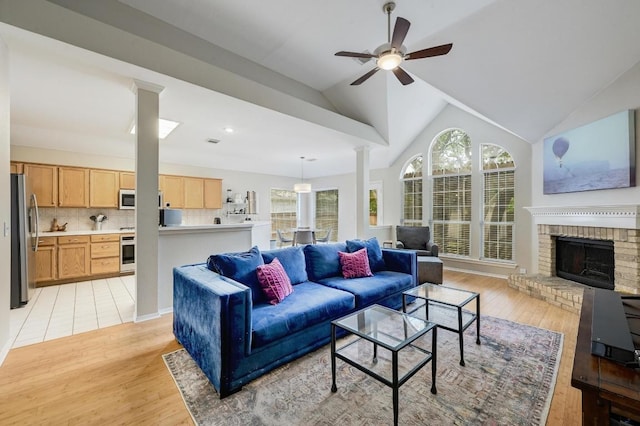 5405 Apache Creek Cv, Austin, TX 78735 - living area featuring a ceiling fan, plenty of natural light, light wood-style flooring, and lofted ceiling