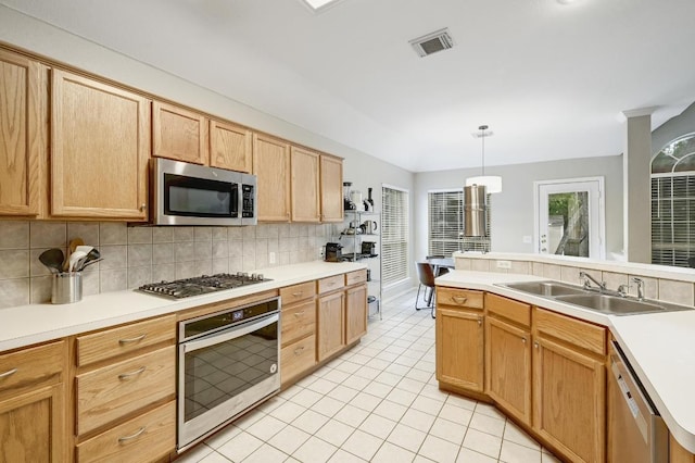 5405 Apache Creek Cv, Austin, TX 78735 - kitchen featuring stainless steel appliances, backsplash, light tile patterned floors, and light countertops