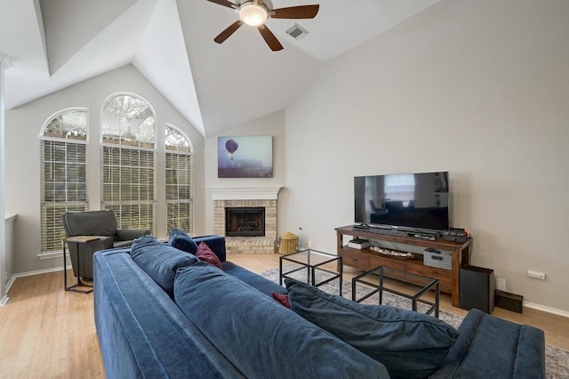 5405 Apache Creek Cv, Austin, TX 78735 - living area with a ceiling fan, wood finished floors, lofted ceiling, a fireplace, and baseboards