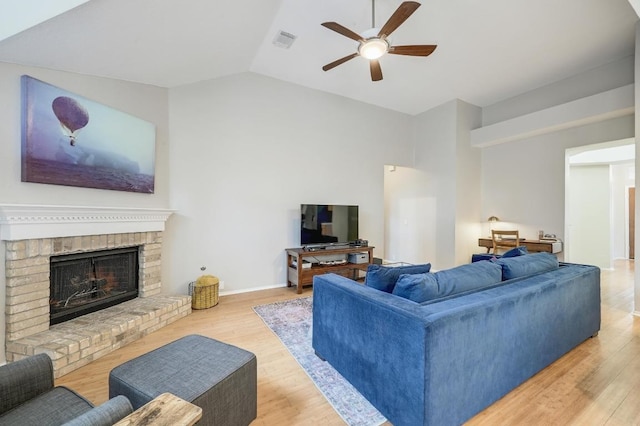 5405 Apache Creek Cv, Austin, TX 78735 - living area with ceiling fan, wood finished floors, lofted ceiling, and a fireplace