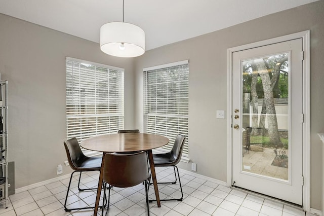 5405 Apache Creek Cv, Austin, TX 78735 - dining room with light tile patterned floors and baseboards