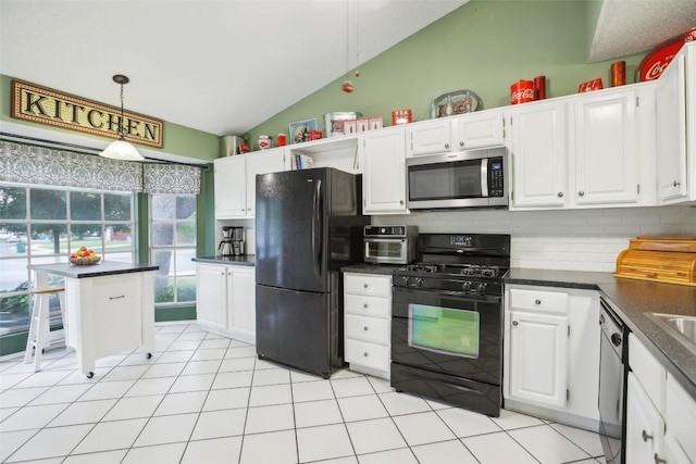 17008 Cactus Blossom Dr, Pflugerville, TX 78660 - kitchen with black appliances, vaulted ceiling, dark countertops, white cabinets, and hanging light fixtures