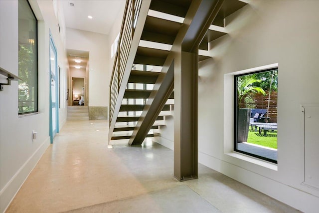 1904 E 9th St, Austin, TX 78702 - staircase featuring concrete floors and a towering ceiling