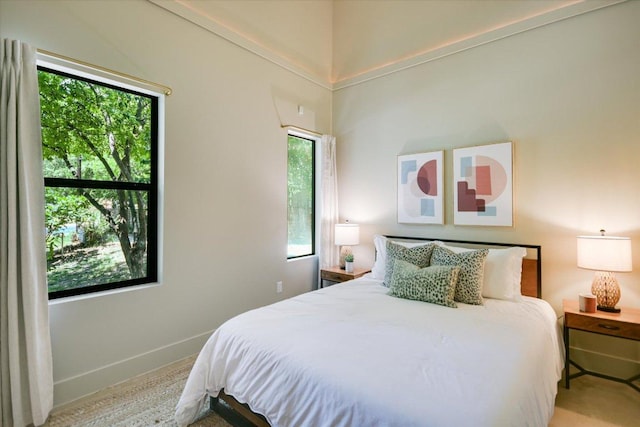 1904 E 9th St, Austin, TX 78702 - carpeted bedroom featuring multiple windows and baseboards