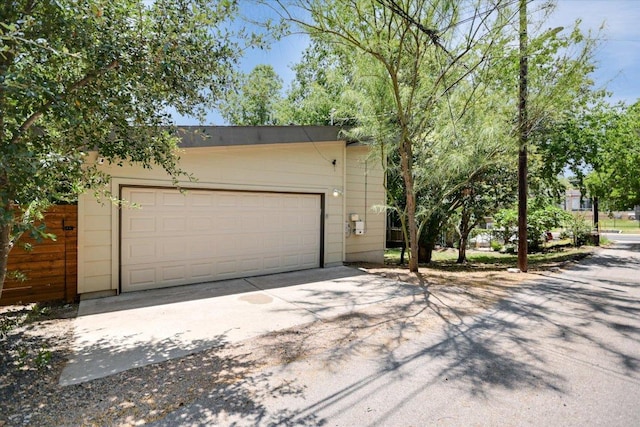 1904 E 9th St, Austin, TX 78702 - view of front of home with concrete driveway and an attached garage