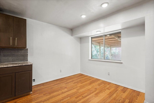 1307 Meadgreen Dr, Austin, TX 78758 - unfurnished dining area featuring light wood finished floors, baseboards, recessed lighting, and ornamental molding