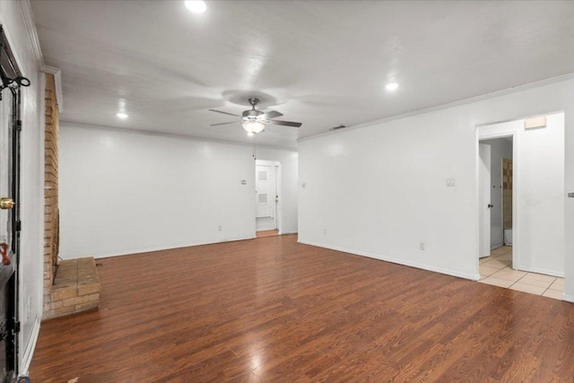 1307 Meadgreen Dr, Austin, TX 78758 - spare room featuring a ceiling fan, crown molding, wood finished floors, recessed lighting, and baseboards