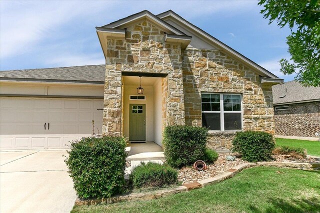 4333 Buffalo Ford Rd, Georgetown, TX 78628 - view of front of home featuring stone siding and an attached garage