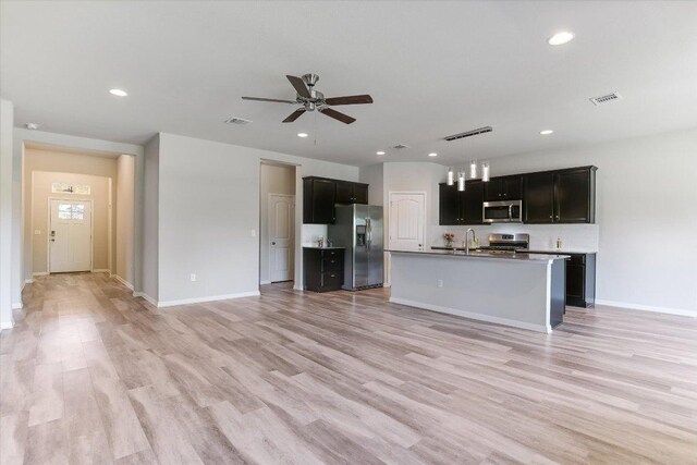 4333 Buffalo Ford Rd, Georgetown, TX 78628 - unfurnished living room with ceiling fan, light wood-style flooring, and recessed lighting