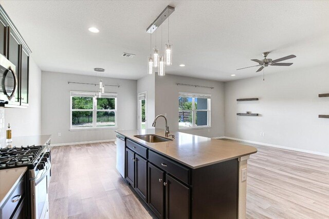 4333 Buffalo Ford Rd, Georgetown, TX 78628 - kitchen featuring open floor plan, light wood finished floors, healthy amount of natural light, and recessed lighting