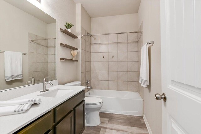 4333 Buffalo Ford Rd, Georgetown, TX 78628 - bathroom featuring vanity, wood finished floors, and washtub / shower combination