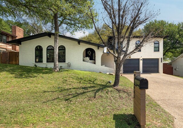 7905 Havenwood Dr, Austin, TX 78759 - view of front of house with driveway and a garage