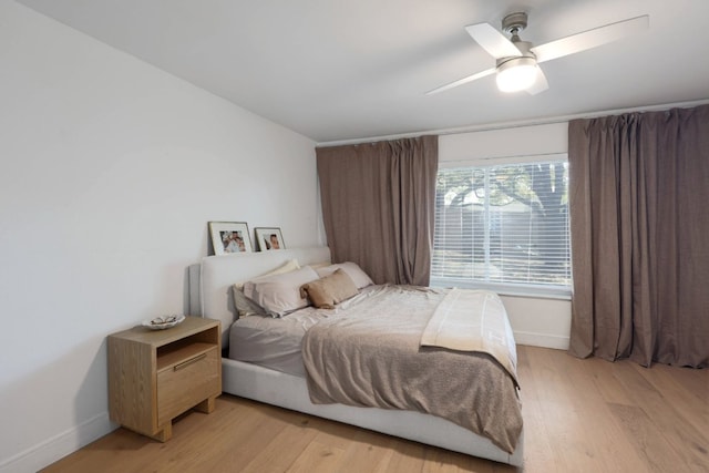 7905 Havenwood Dr, Austin, TX 78759 - bedroom with light wood-style flooring and a ceiling fan