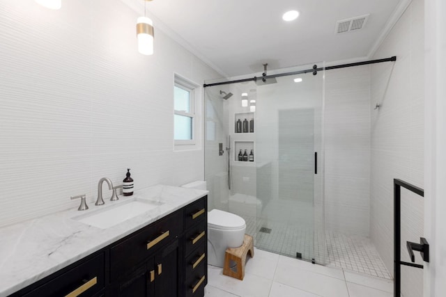 7905 Havenwood Dr, Austin, TX 78759 - full bathroom featuring crown molding, vanity, a shower stall, tile patterned floors, and tile walls