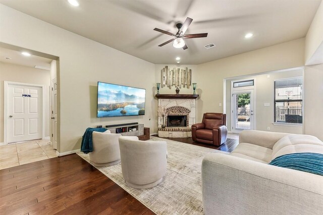 2415 Berkshire Way, Cedar Park, TX 78613 - living room featuring wood finished floors, a ceiling fan, recessed lighting, and a stone fireplace