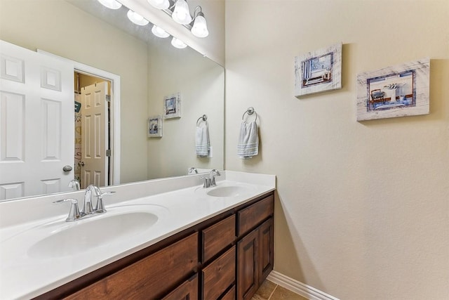 2415 Berkshire Way, Cedar Park, TX 78613 - bathroom featuring double vanity and tile patterned floors