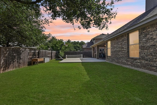 2415 Berkshire Way, Cedar Park, TX 78613 - yard at dusk featuring a patio area and a fenced backyard