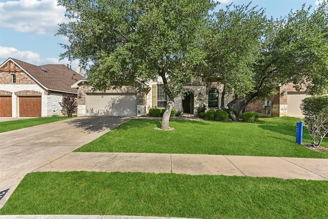 2415 Berkshire Way, Cedar Park, TX 78613 - view of front of home featuring stone siding, concrete driveway, a front yard, and an attached garage