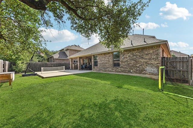 2415 Berkshire Way, Cedar Park, TX 78613 - back of property with brick siding, a fenced backyard, a shingled roof, and a patio area