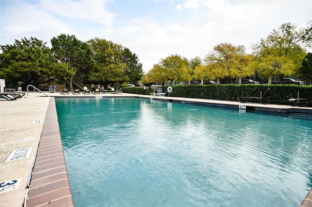 2450 Wickersham Ln Unit 718, Austin, TX 78741 - community pool featuring a patio