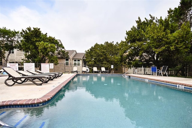 2450 Wickersham Ln Unit 718, Austin, TX 78741 - community pool with a patio area