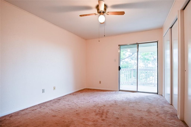 2450 Wickersham Ln Unit 718, Austin, TX 78741 - empty room featuring carpet floors, a ceiling fan, and baseboards