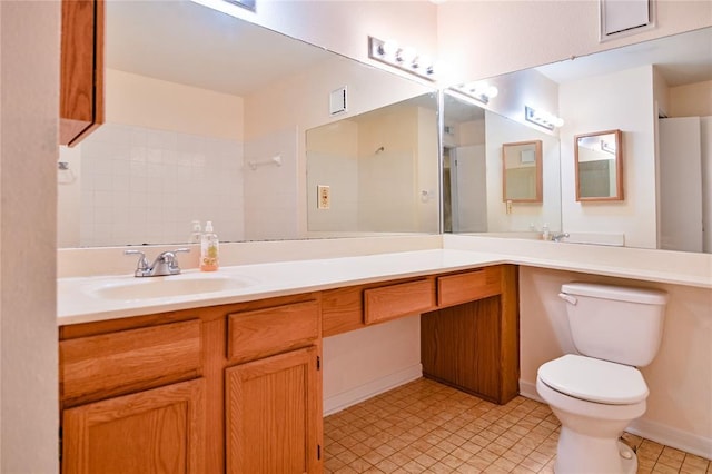 2450 Wickersham Ln Unit 718, Austin, TX 78741 - full bath with toilet, vanity, tile patterned floors, and baseboards