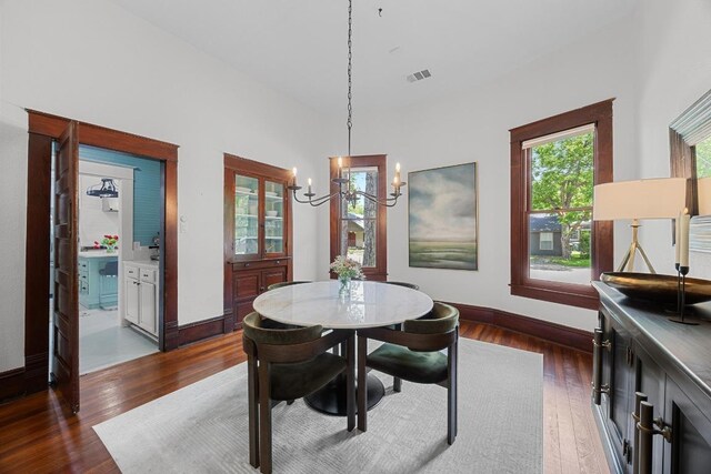 1502 S Elm St, Georgetown, TX 78626 - dining room featuring a chandelier and dark wood finished floors