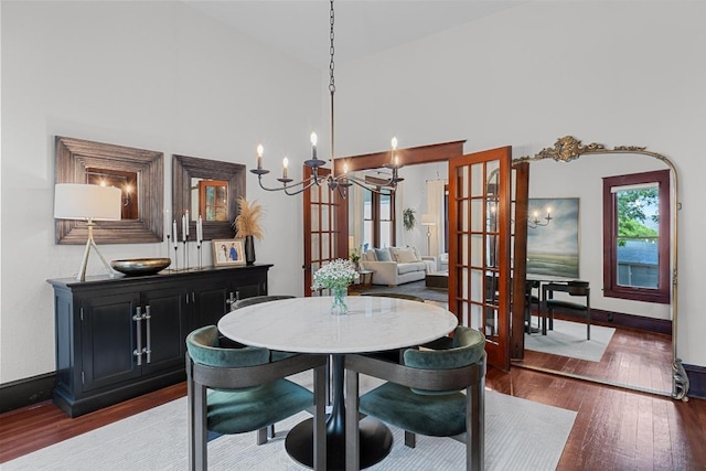 1502 S Elm St, Georgetown, TX 78626 - dining area featuring a chandelier, wood finished floors, french doors, and a high ceiling