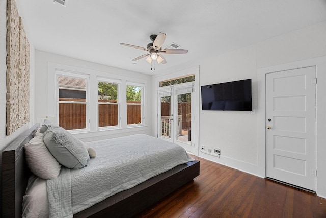 1502 S Elm St, Georgetown, TX 78626 - bedroom with access to exterior, dark wood-style floors, and a ceiling fan
