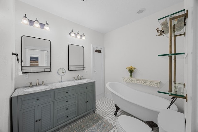 1502 S Elm St, Georgetown, TX 78626 - bathroom featuring a freestanding bath and double vanity