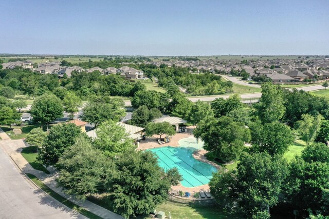 2937 Castellan Ln, Round Rock, TX 78665 - aerial perspective of suburban area with a pool and a tree filled landscape