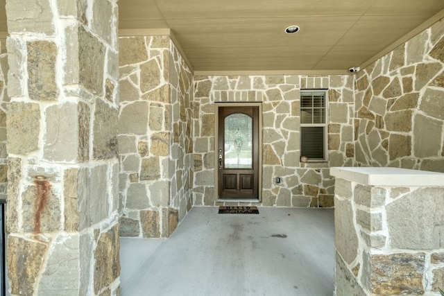 2937 Castellan Ln, Round Rock, TX 78665 - doorway to property with stone siding and a surveillance system