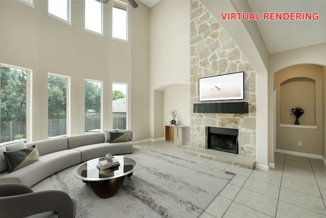 2937 Castellan Ln, Round Rock, TX 78665 - living area featuring a towering ceiling, tile patterned floors, and a fireplace